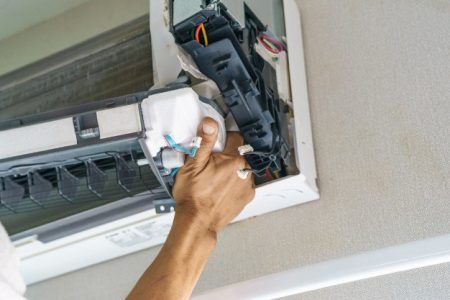 service-technician-is-cleaning-repair-maintenance-air-conditioner service-technician-is-cleaning-repair-maintenance-air-conditioner | handyman in dubai | Hnadyman services in dubai
